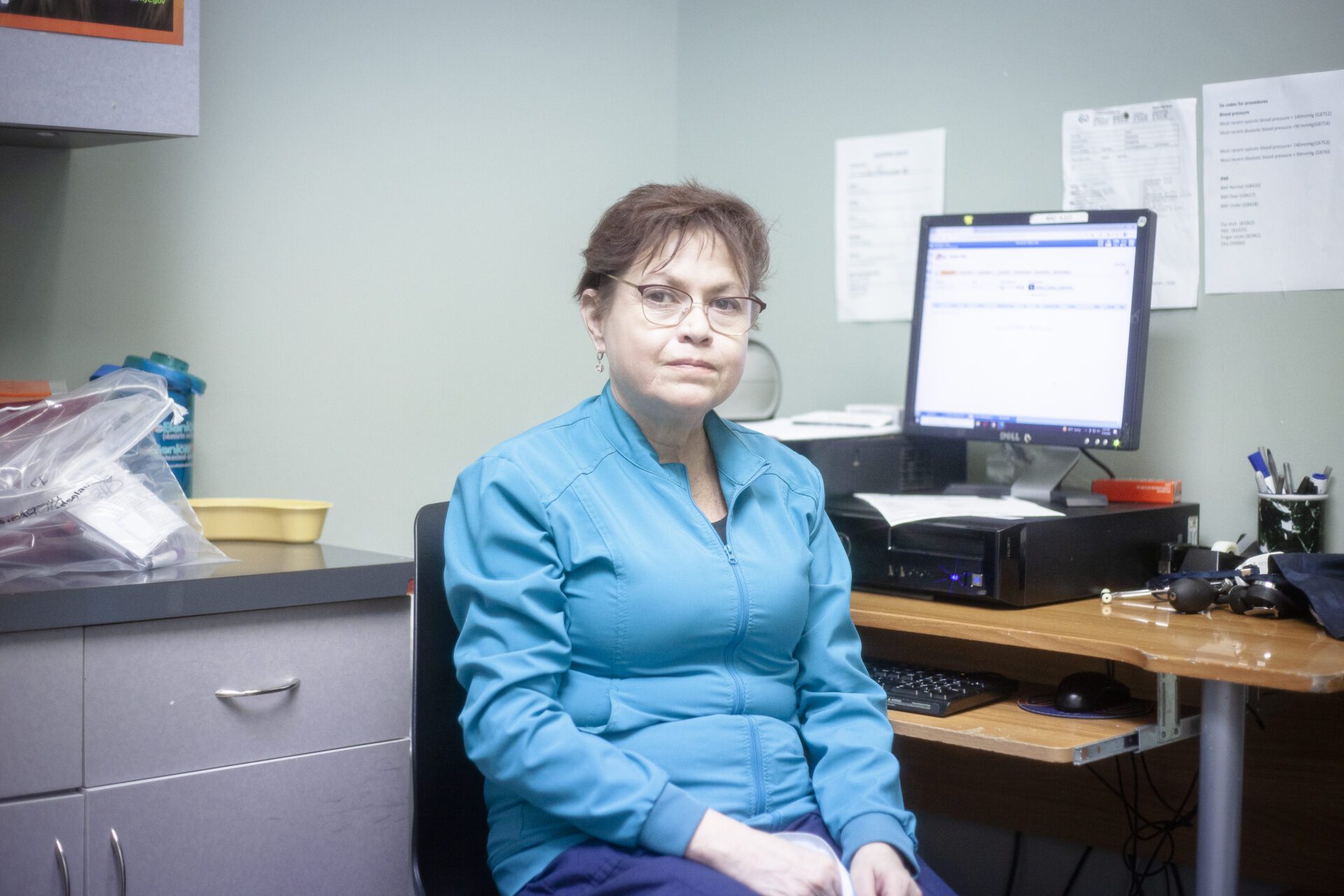 New York Medical and Vascular Care staff sitting at her office desk
